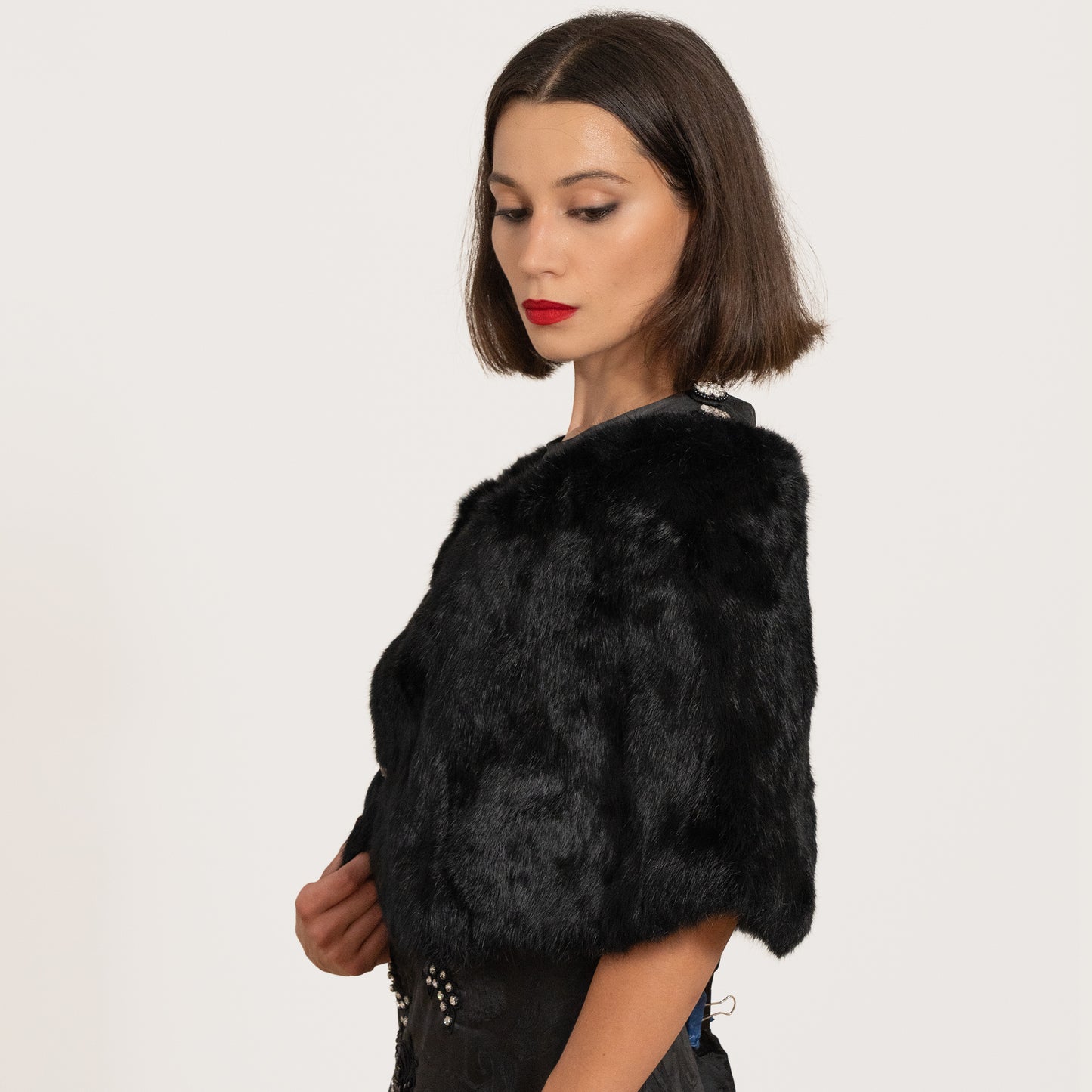 brunette model wearing an elegant evening fur