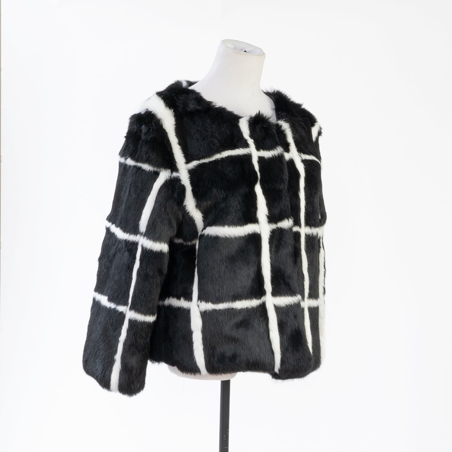 side view of a black and white rabbit fur coat