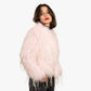 Model wearing a pink fur coat with silver sparkles