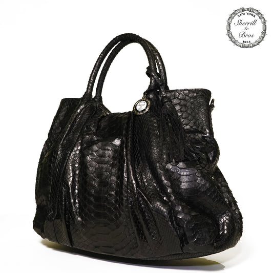 side view of real black python skin large handbag with handles and shoulder strap 