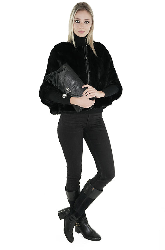 Woman with black python clutch handbag from Sherrill Bros
