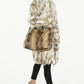 Model with brown python hobo handbag and fur coat from sherrill bros