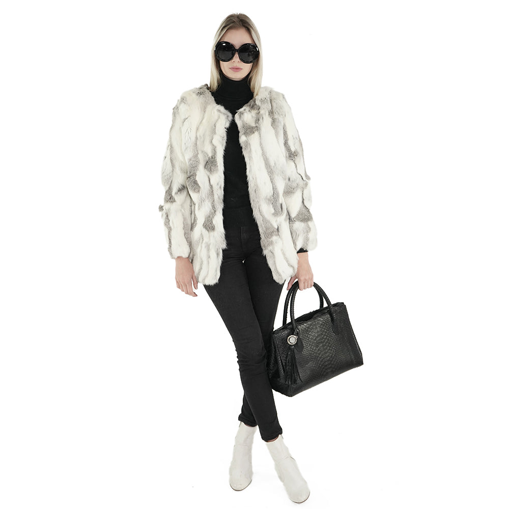 blonde woman with a genuine fur coat and python tote sherrill bros