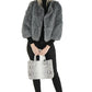 woman with gray python tote bag and gray fur coat from Sherrill Bros
