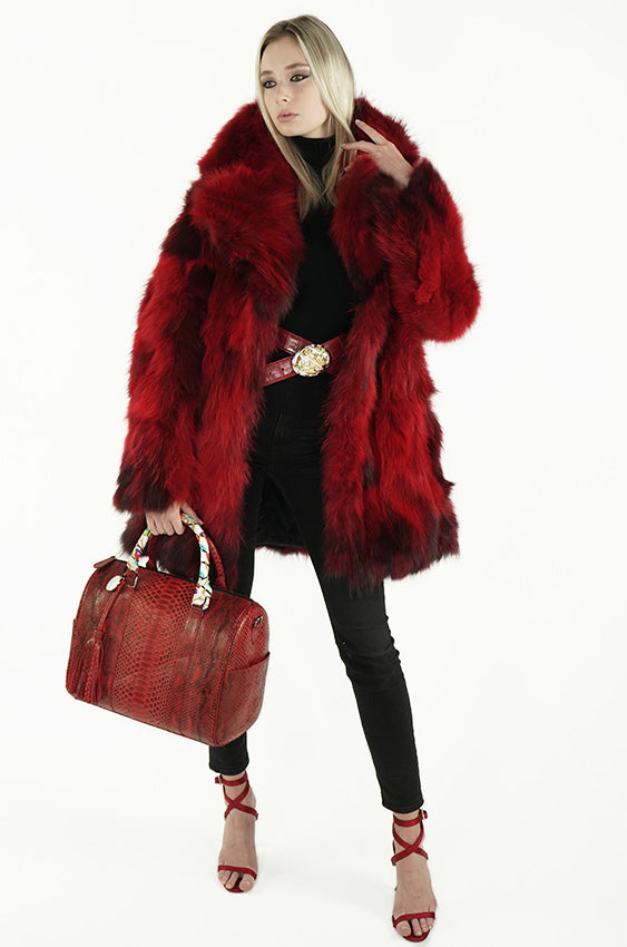Woman with red python duffel handbag and red fur coat from sherrill bros 