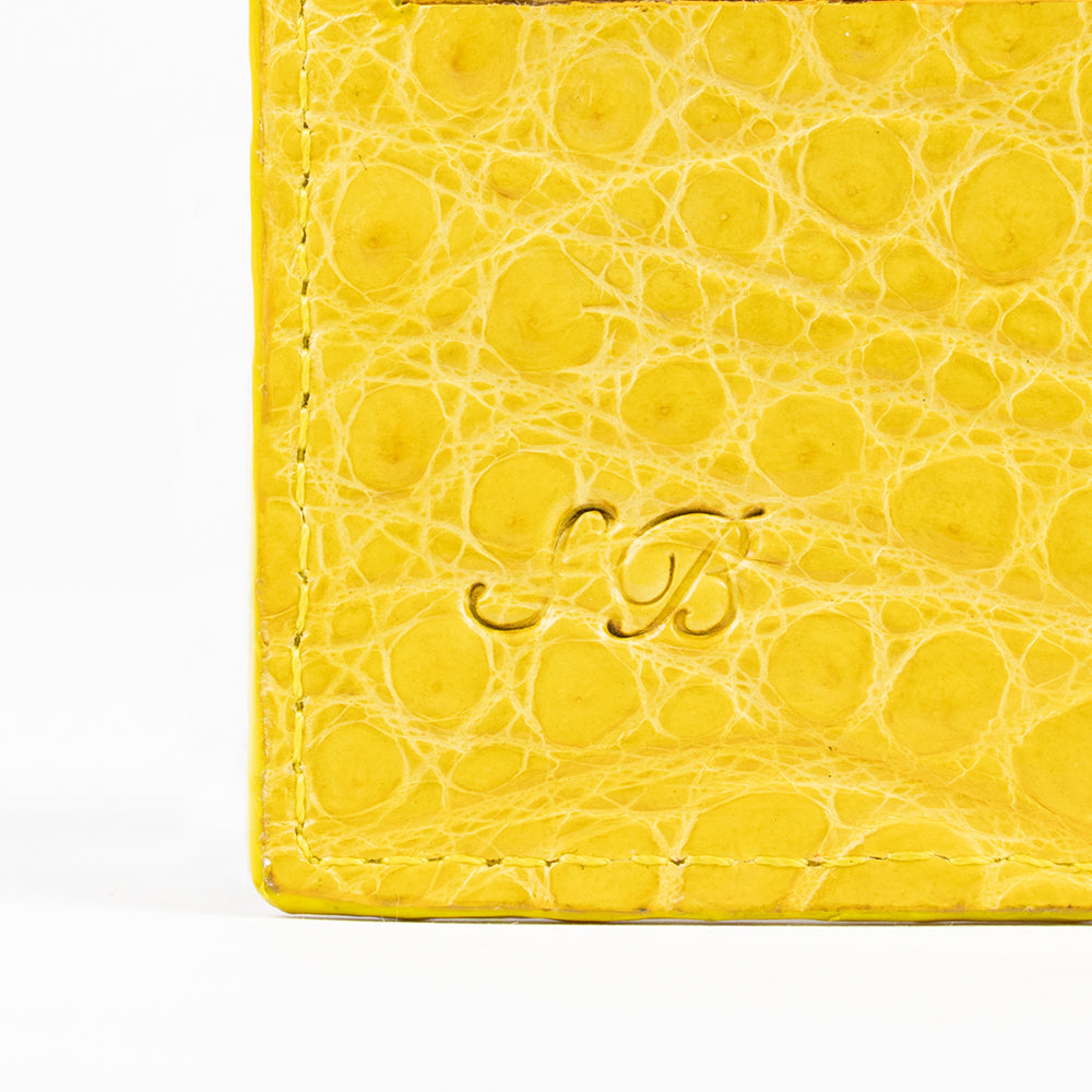 Signature stamp on yellow leather wallet 